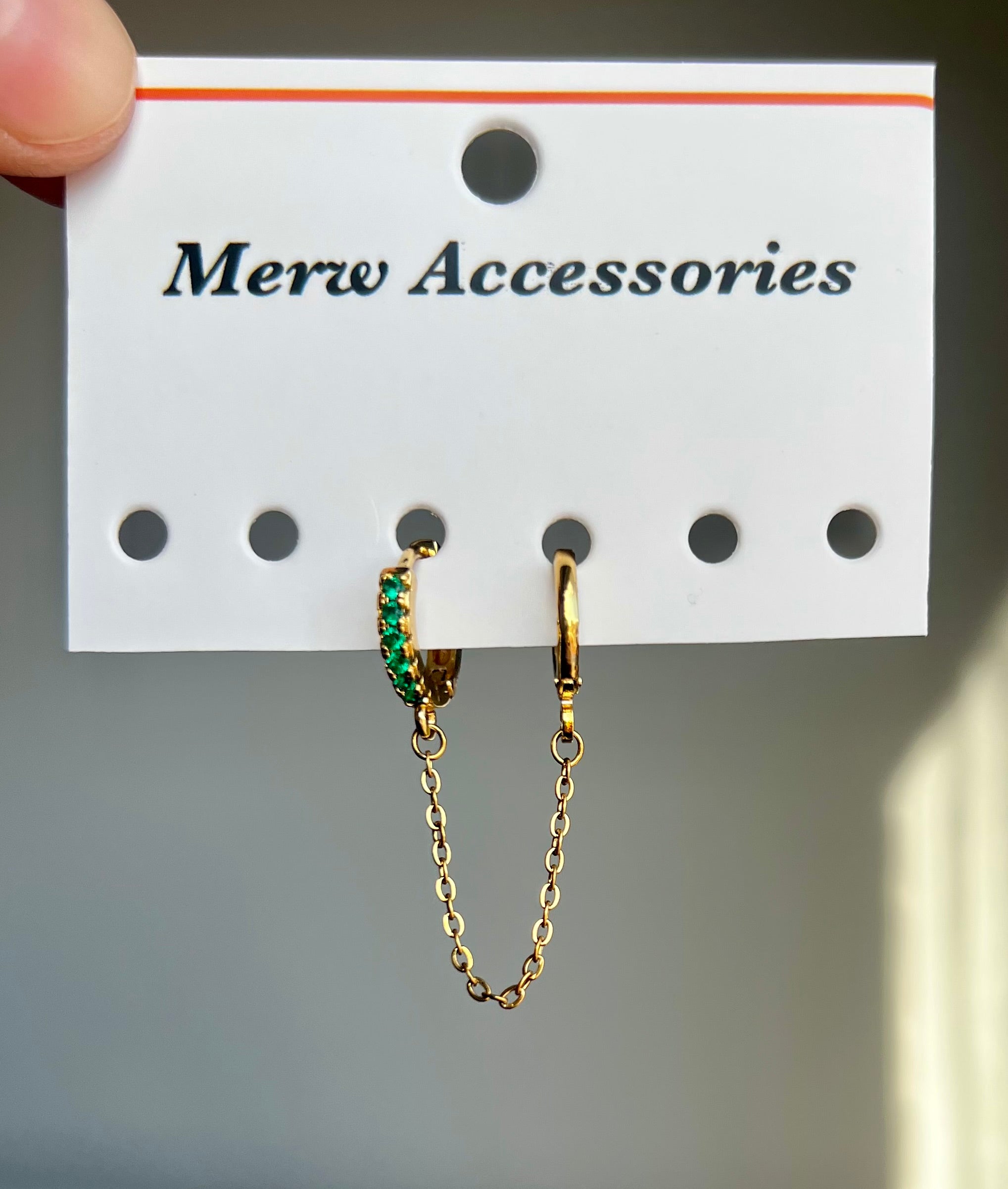 Green stones connect earring